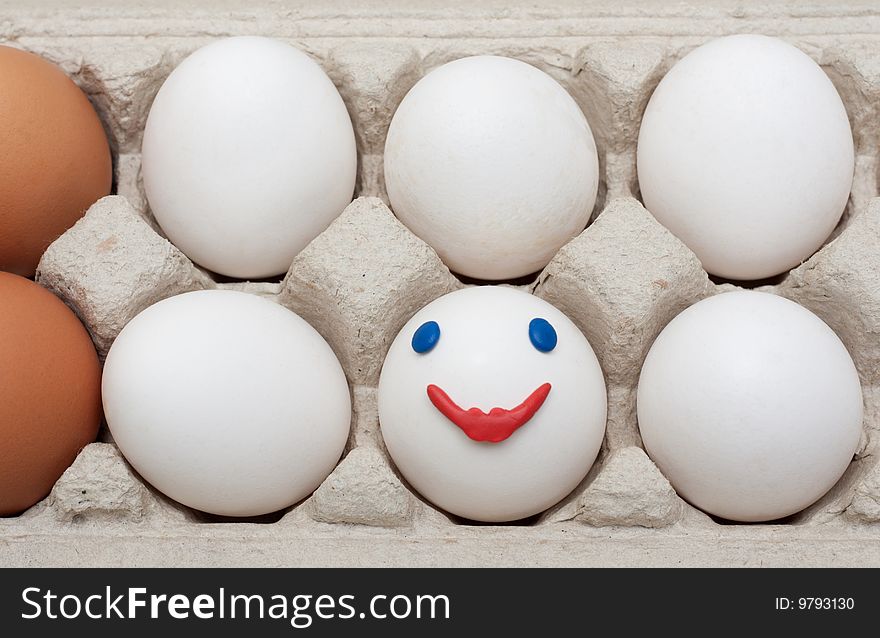 Egg in packing, smile