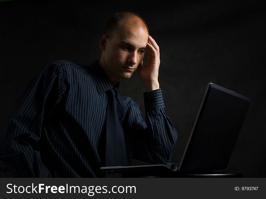 Businessman working on computer late at night