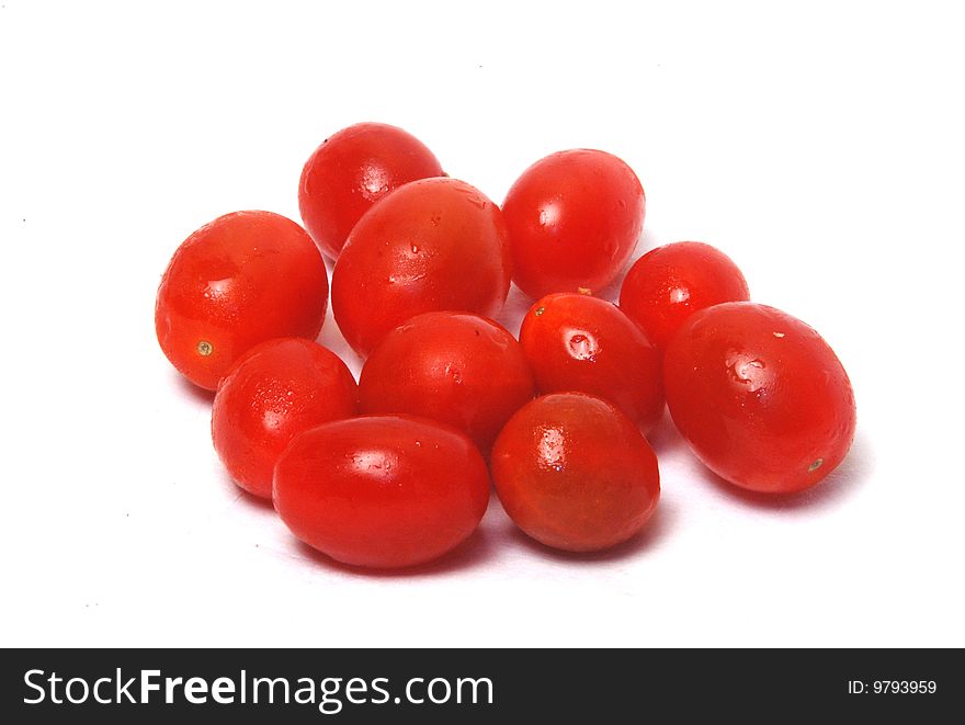 Tiny tomatoes on white background