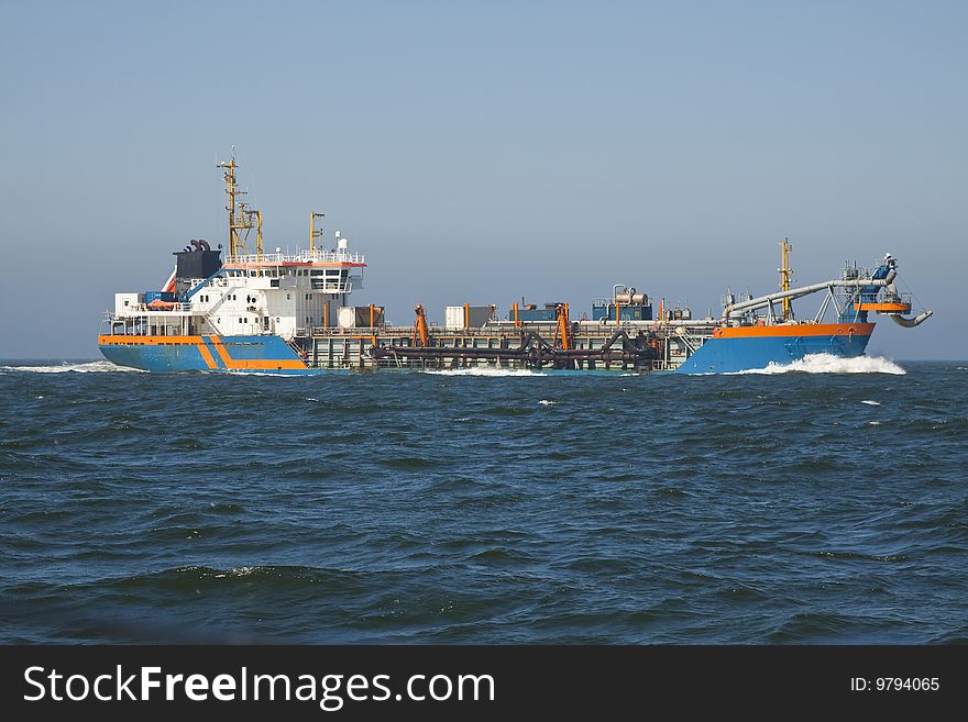 A Trailing suction hopper Dredger at Work. A Trailing suction hopper Dredger at Work