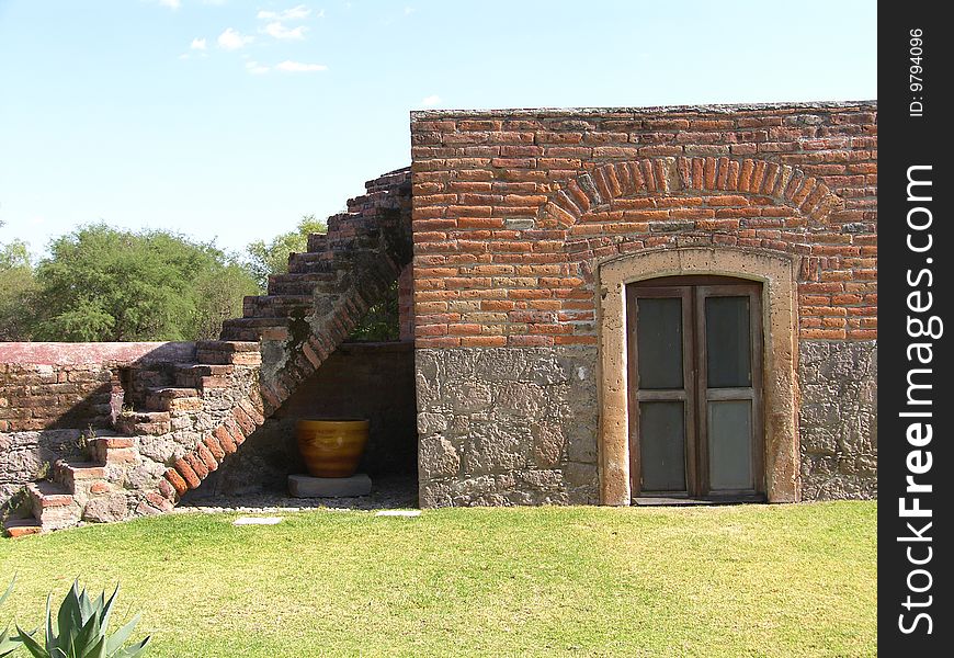 Pic of a stair and window made with bricks at an old Hacienda. Pic of a stair and window made with bricks at an old Hacienda