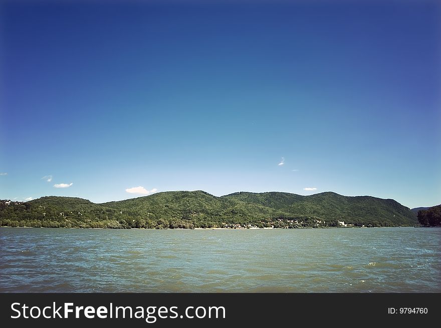 Landscape with river and green hills