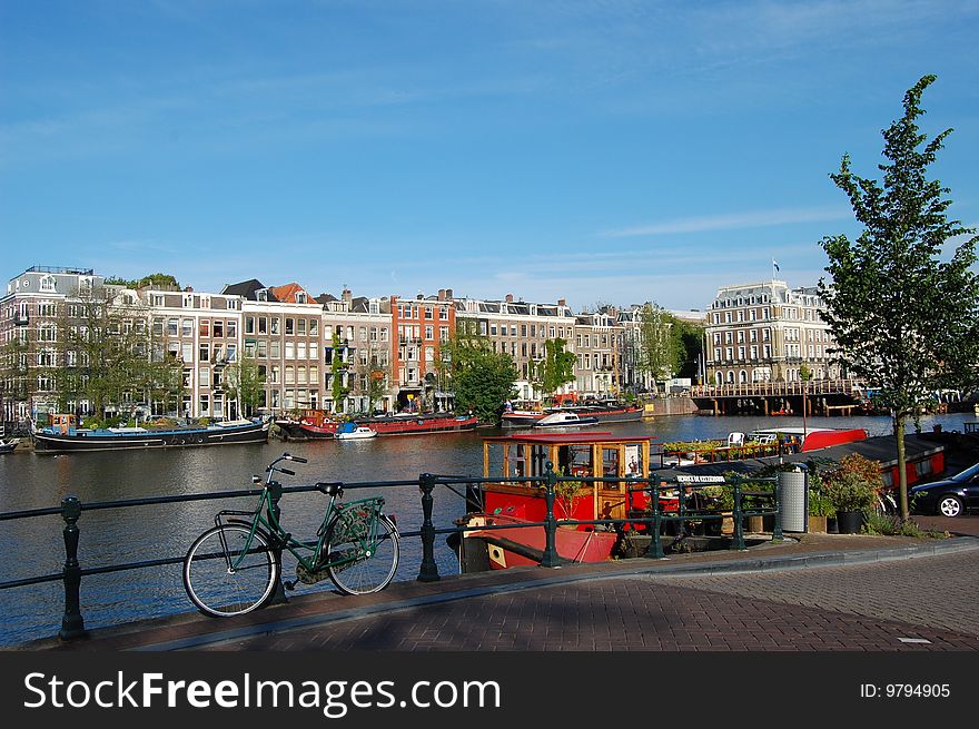 A bike in front of some old Canal Houses in Amsterdam. A bike in front of some old Canal Houses in Amsterdam