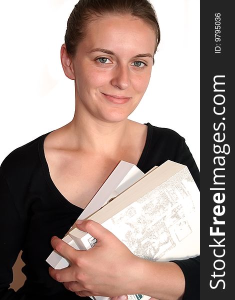 Young girl holding a book isolated on white. Young girl holding a book isolated on white