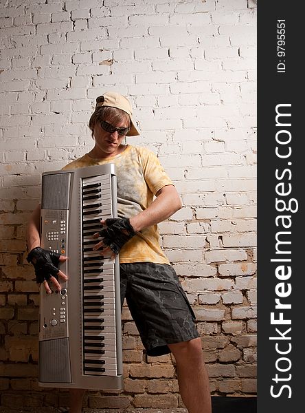 Portrait of musician with synthesizer