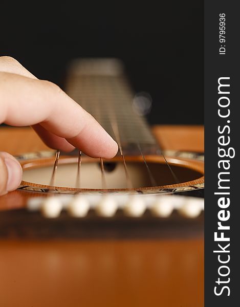 Macro of a guitar players fingers. Macro of a guitar players fingers