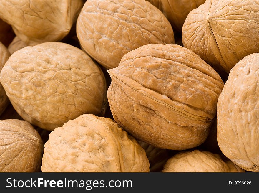 Background of walnuts, close up studio shot.