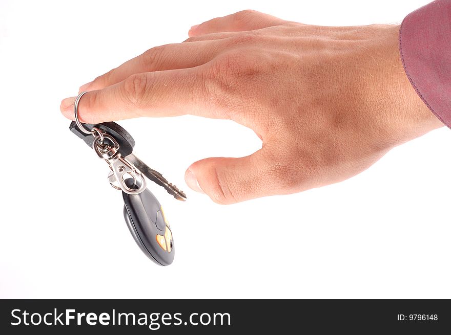 Car keys on a hand on a white background