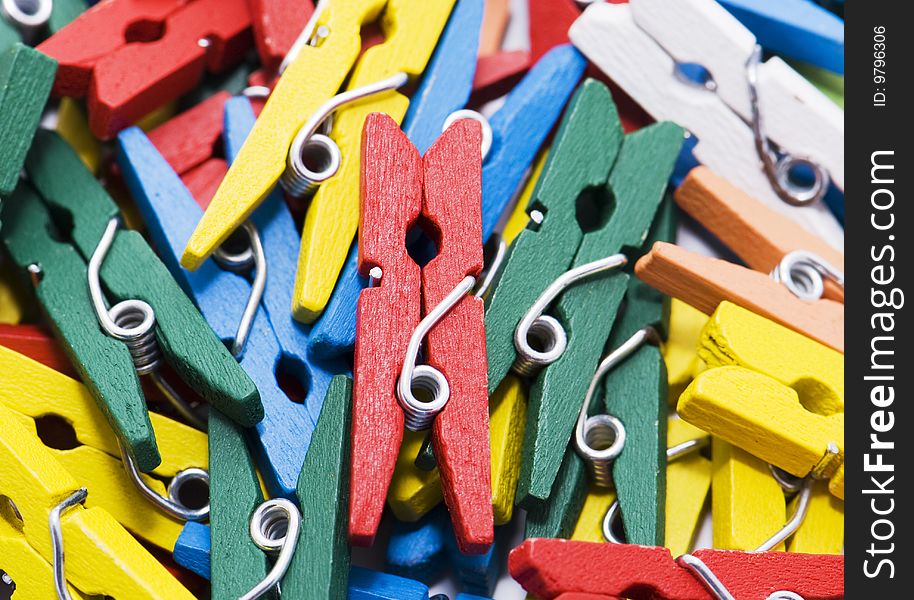 Many small colour writing clothespins