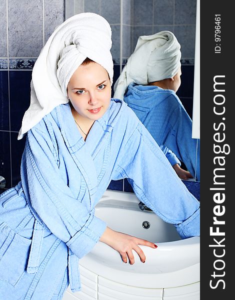 Portrait of a beautiful young woman in a bathroom. Portrait of a beautiful young woman in a bathroom.