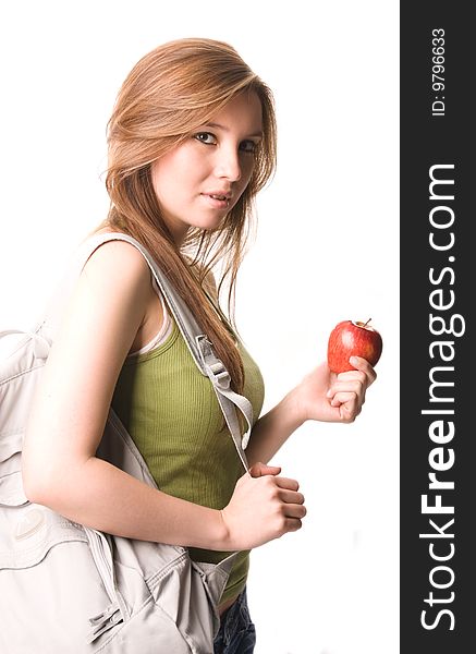 Young and beautiful student with apple and books