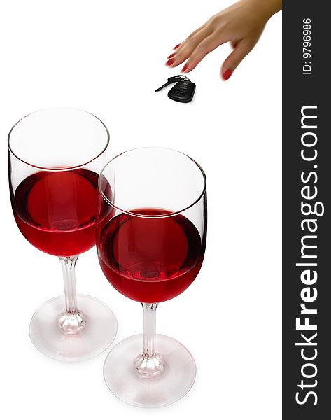 Two glasses of red wine with a woman's hand reaching for car keys. Two glasses of red wine with a woman's hand reaching for car keys