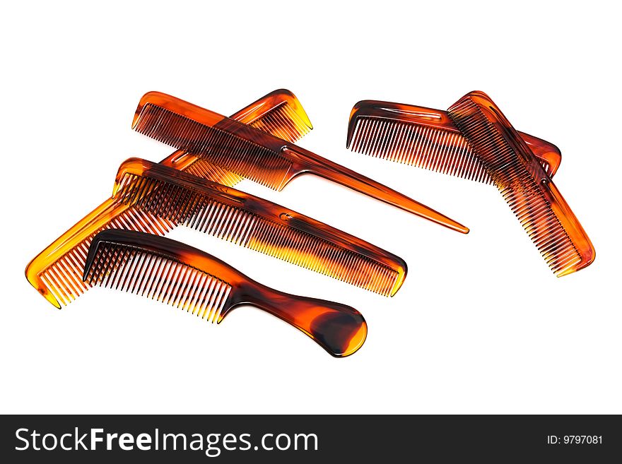 Set of beautiful hairbrushes on a white background. Set of beautiful hairbrushes on a white background