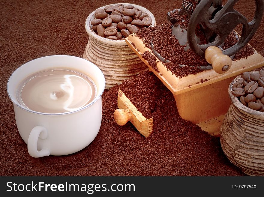 Coffee-hand grinder, grains and cups. Coffee-hand grinder, grains and cups.