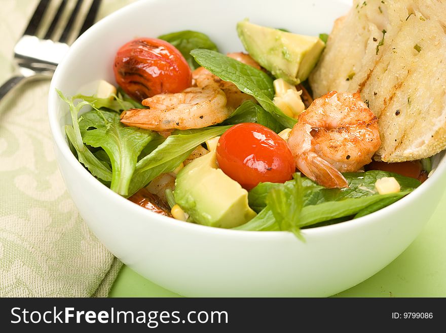 Grilled Shrimp salad with mache served with grilled bread