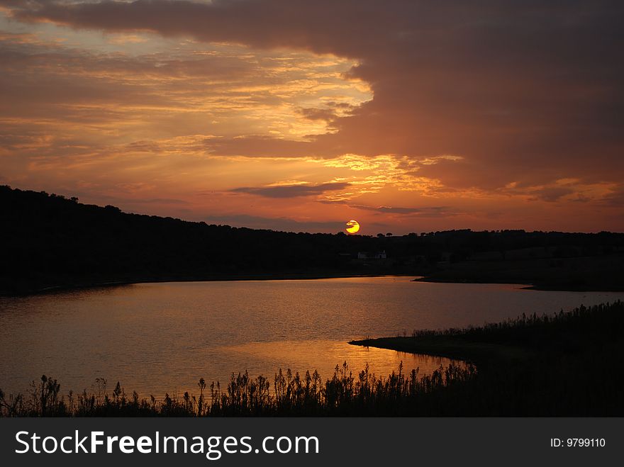 Sunset with a still lagoon and clouds. Sunset with a still lagoon and clouds.