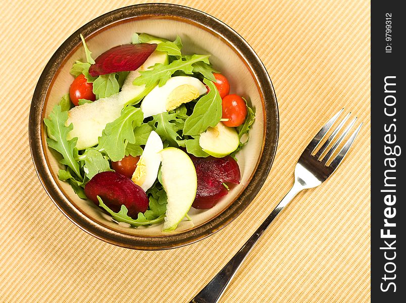 Arugula Salad in dark metallic glazed bowl