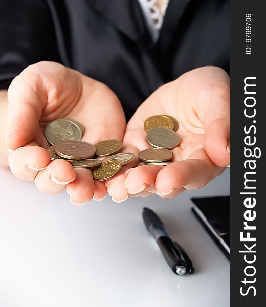 Handful of coins in female hands