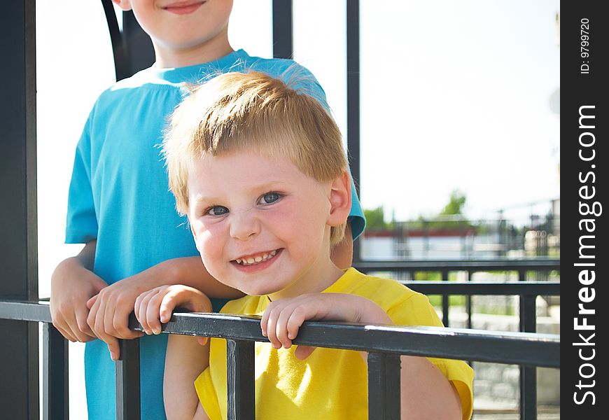 Two boys play  in the spring. Two boys play  in the spring