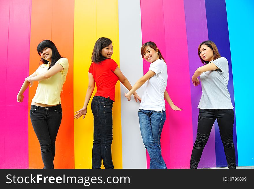 Beautiful Young Ladies With Colourful Background. Beautiful Young Ladies With Colourful Background.