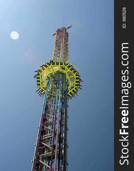 Passenger platform of a carnival free fall tower speeding down. Passenger platform of a carnival free fall tower speeding down