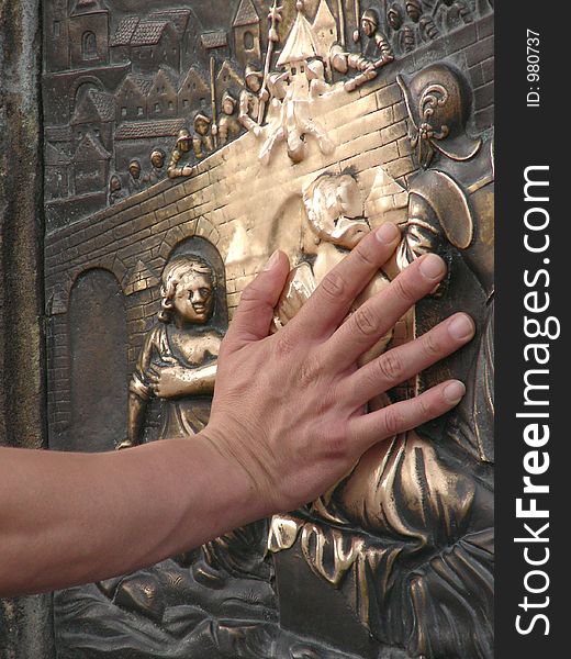 Making a wish on a Charles bridge in Prague