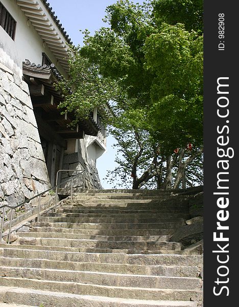 Japanese stone steps beside a Japanese palace