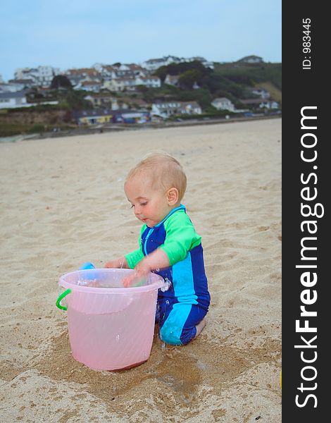 Small child exploring a beach in Cornwall. Small child exploring a beach in Cornwall.