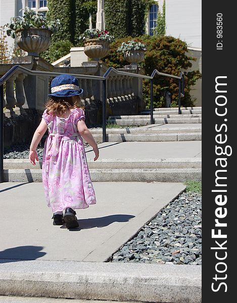This is a picture of a girl walking up steps. This is a picture of a girl walking up steps
