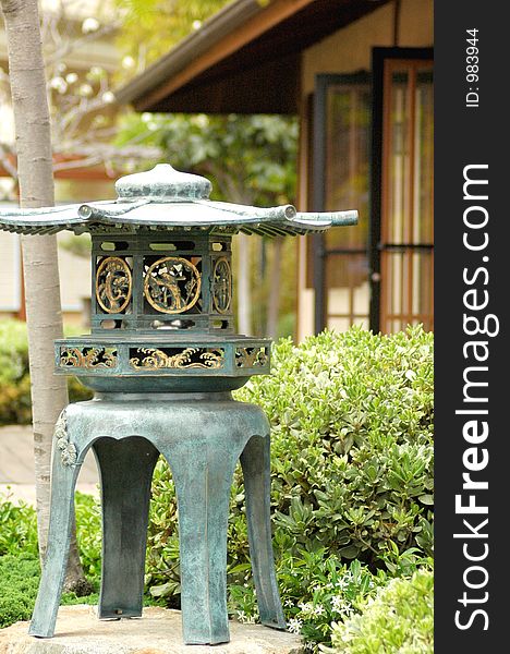 A Japanese lantern in a zen garden. A Japanese lantern in a zen garden