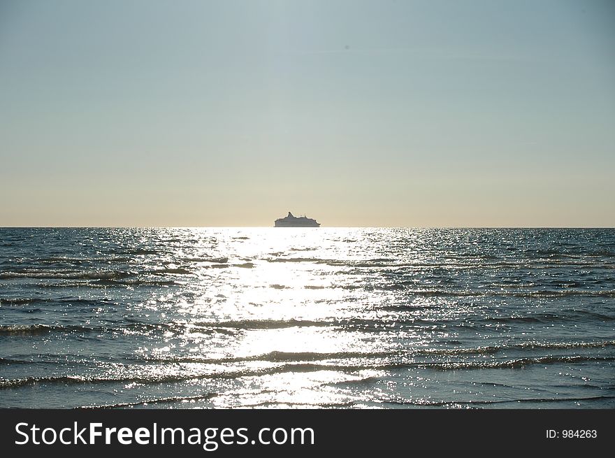 Sunset with boat by the horizon