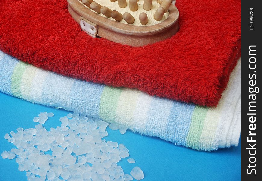 Two towels, sea salt and massage brush. Two towels, sea salt and massage brush