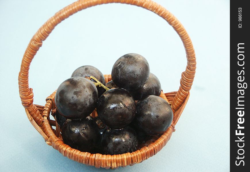 Small basket with black berries. Small basket with black berries
