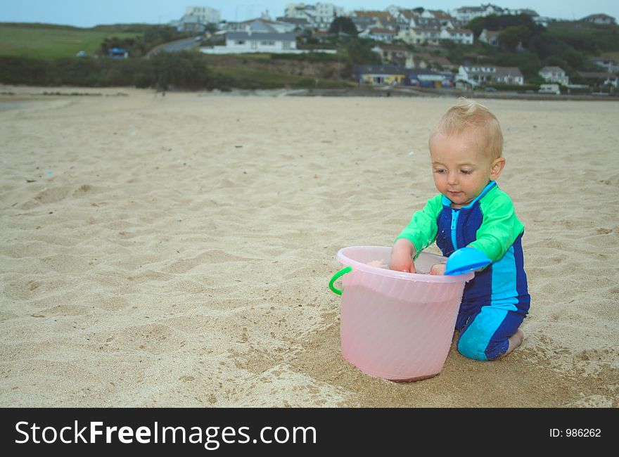 Small child exploring a beach in Cornwall. Small child exploring a beach in Cornwall.