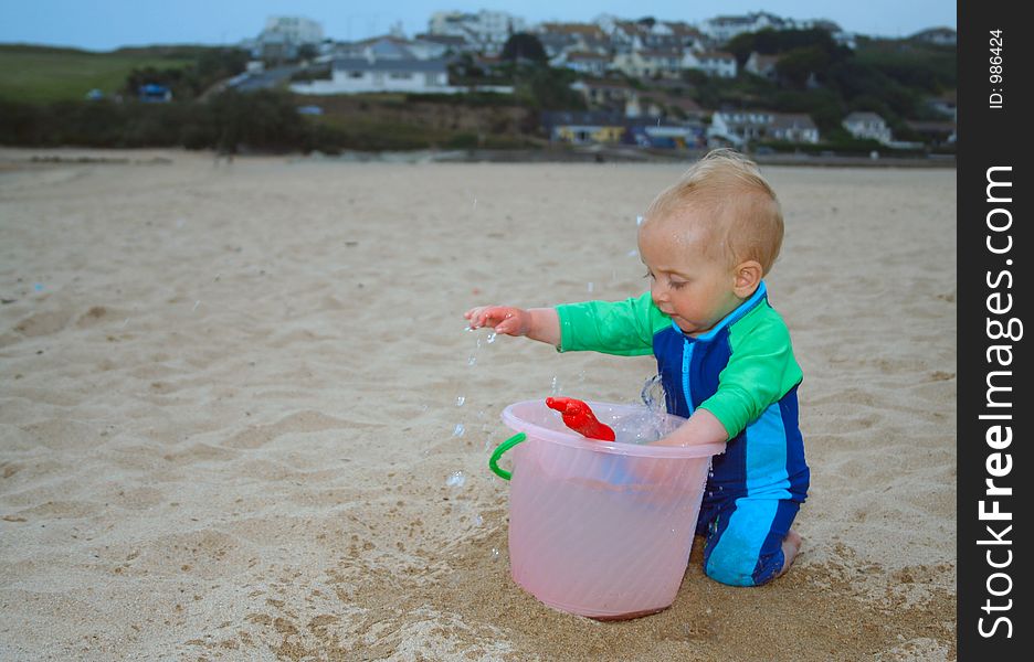 Small child exploring a beach in Cornwall. Small child exploring a beach in Cornwall.