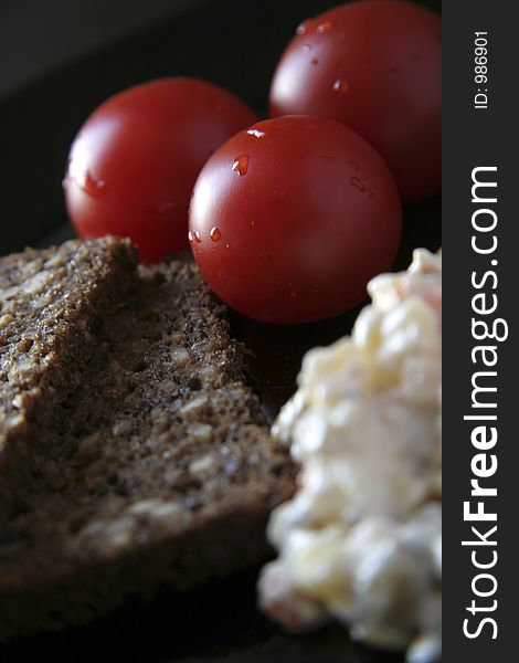 Picture of fresh tomatoes, brown bread and salad. Picture of fresh tomatoes, brown bread and salad