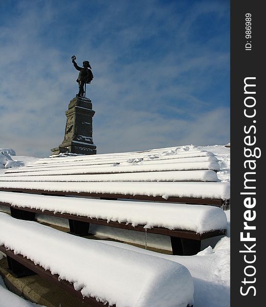 Statue on top of stairs covered in snow. Statue on top of stairs covered in snow