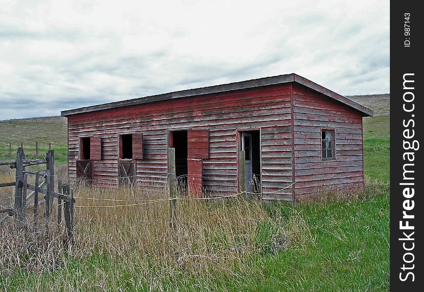 This image of the abandoned stable and fence was taken in Kalispell, MT.