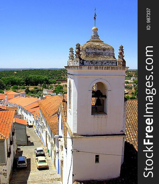 Typical street of the old and historical village of Alandroal, where if salient the sineira tower of the first church.