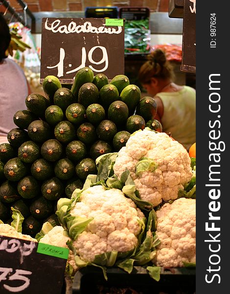 Cauliflower and courgettes on market stall with price. Cauliflower and courgettes on market stall with price