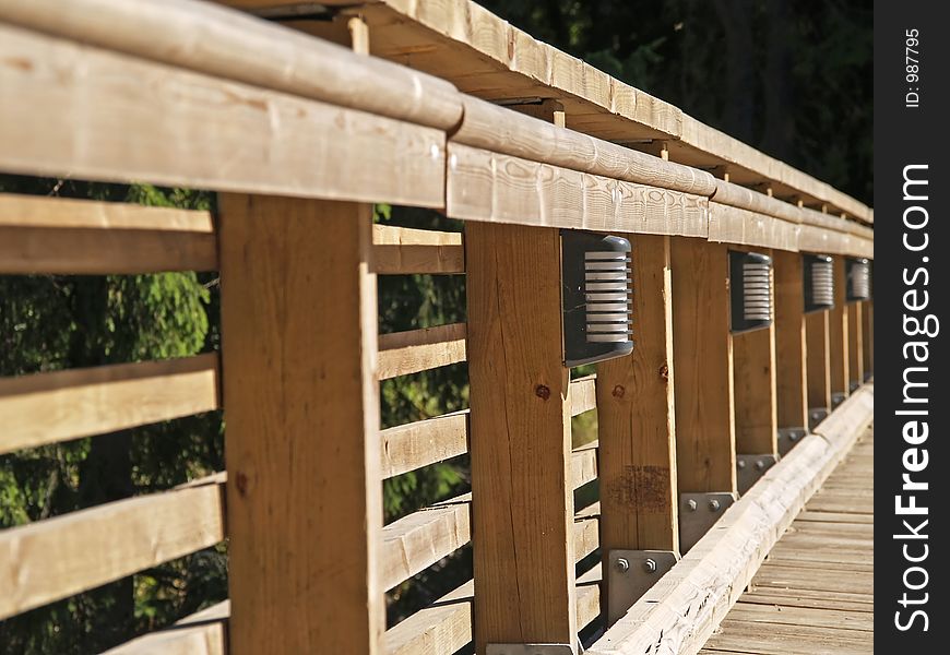 The wooden rail of the bridge