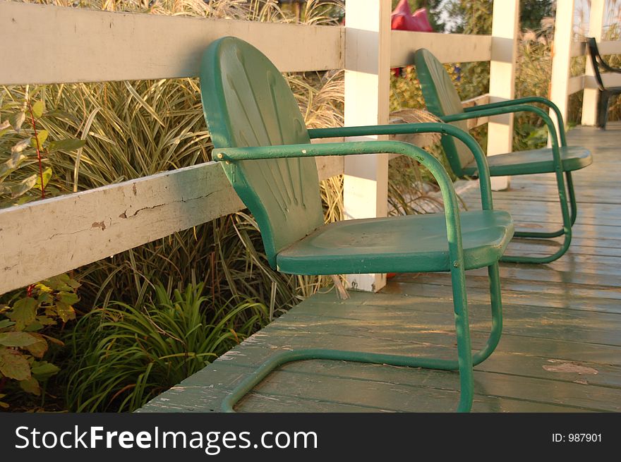 Green chairs on deck at pumpkin patch