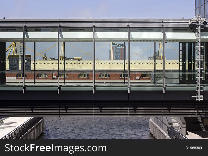 Glassed walkway bridge in docklands, london