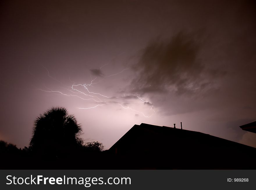 Two lightning strikes loop back into each other. Two lightning strikes loop back into each other