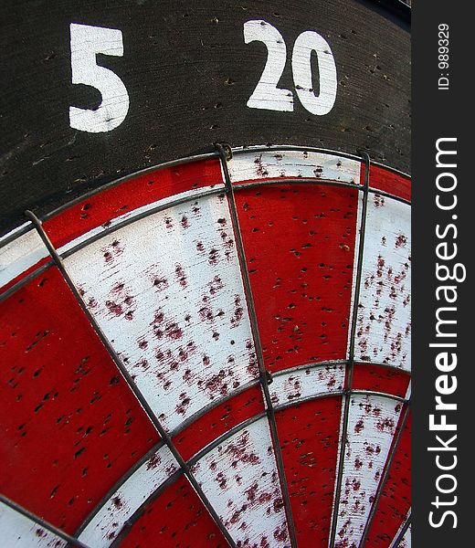 A well used dart board. A well used dart board