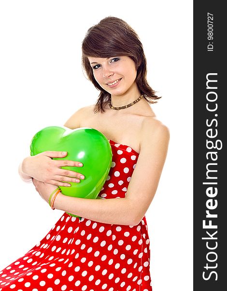 Young pretty girl in dot polka dress on white background