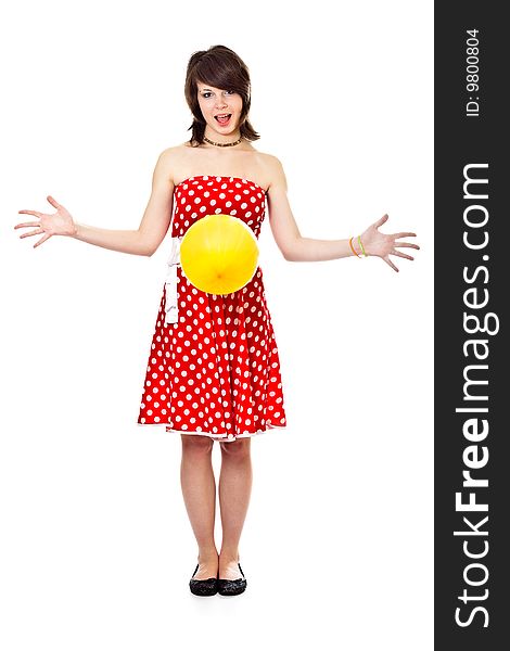 Young pretty girl in dot polka dress on white background