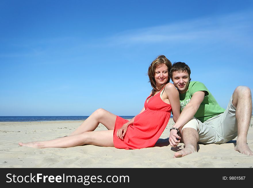 Young couple relaxing on the beach. Young couple relaxing on the beach