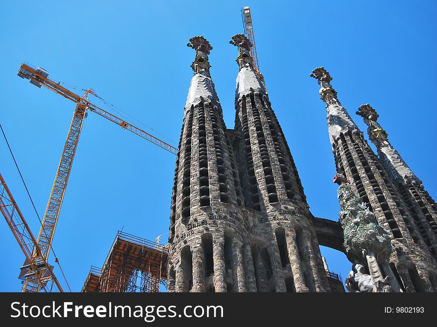 Construction Of Sagrada Familia on a blue sky