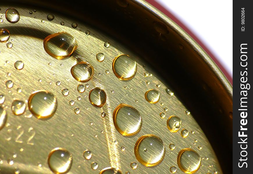 Water drops on gold tin. Water drops on gold tin